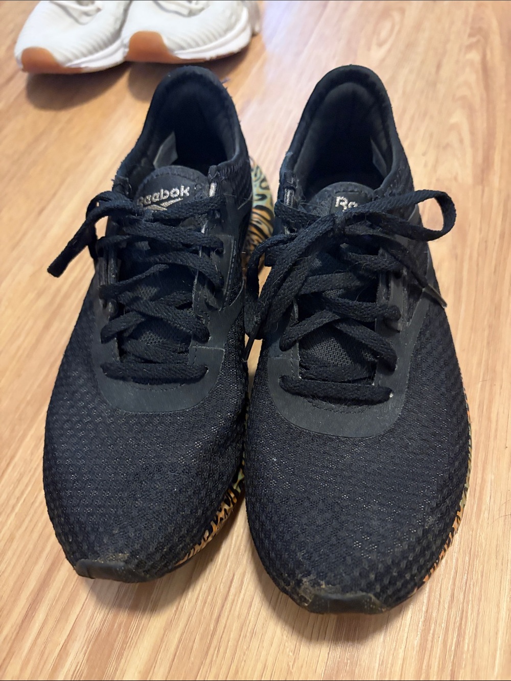 Reebok womenβs Black Athletic Training Shoes with Subtle Gum Accent